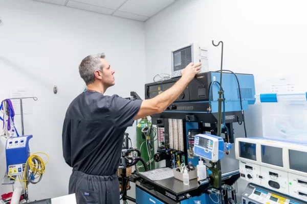 doctor looking at medical machine 19